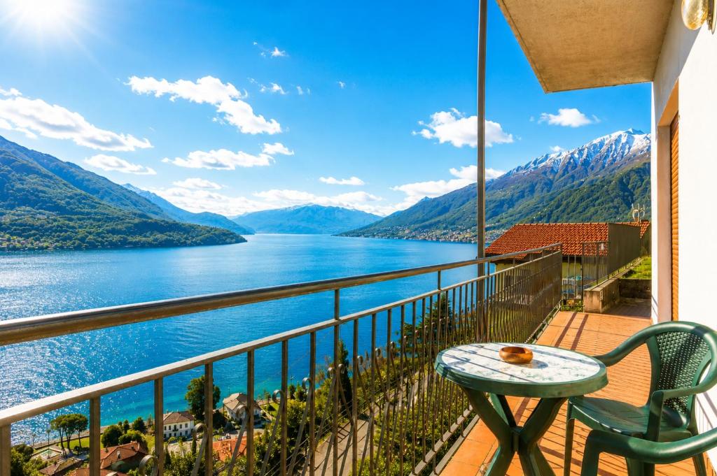 a balcony with a table and a view of a lake at Apartment Alex 2 in Domaso in Domaso