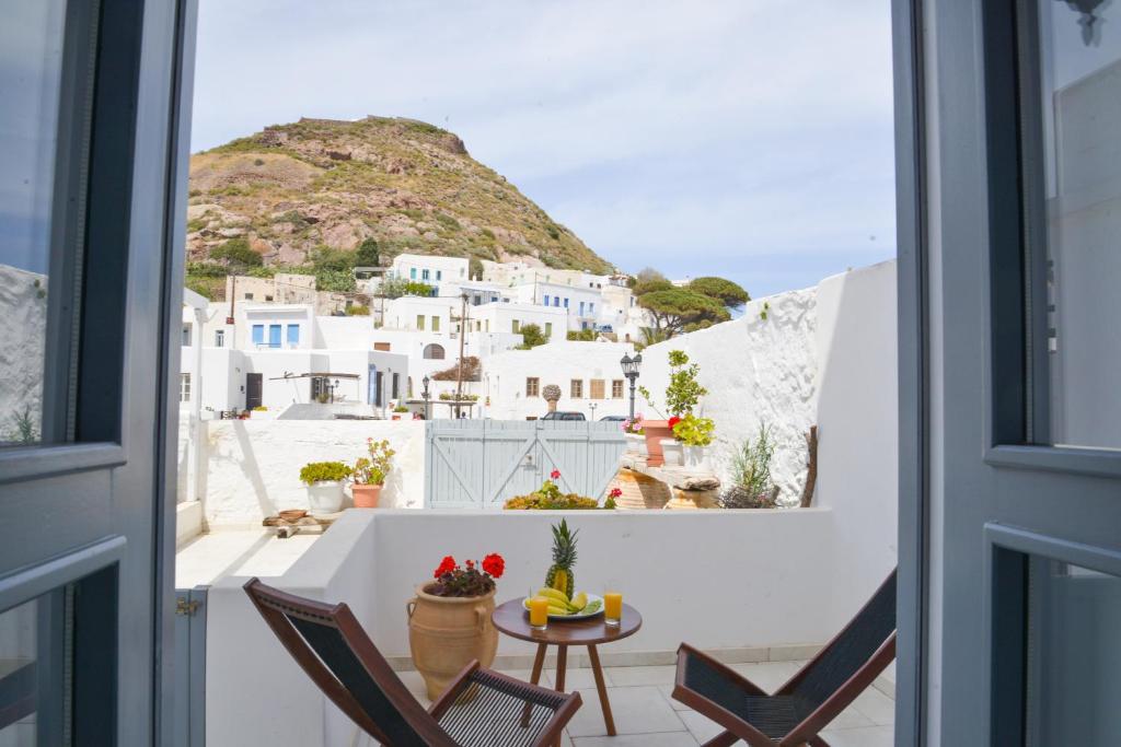 a view from the window of a room with a table and chairs at Kastro View Apartment in Plaka Milou