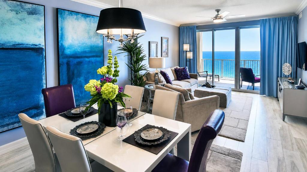 a living room with a dining table and a living room at Luxury Vacation Escape Free Beach Service Come Relax Book Now! in Panama City Beach