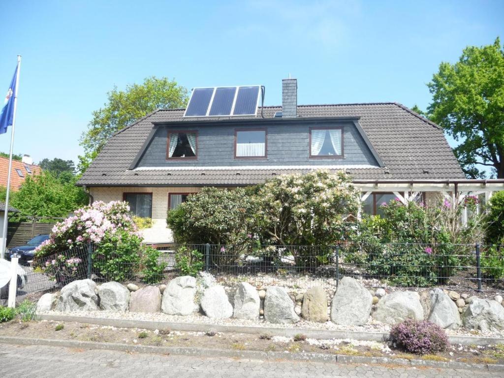 a house with solar panels on top of it at TheSlowMorningNo1 in Cuxhaven