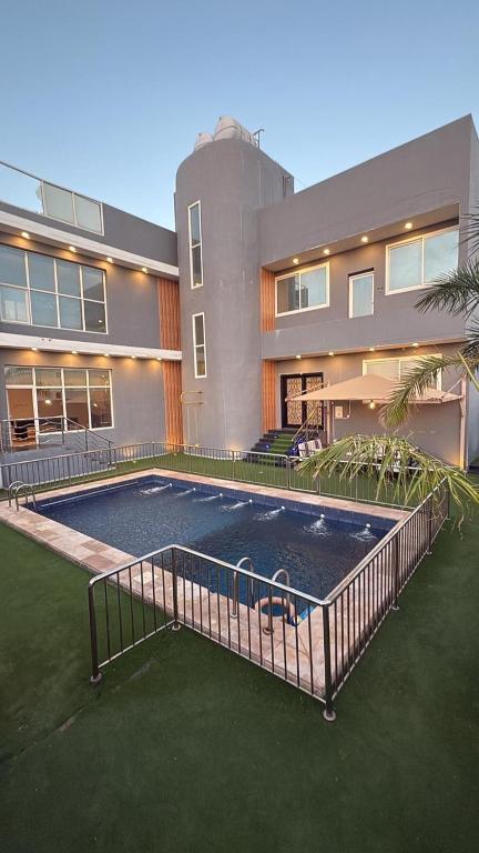 a house with a tennis court in front of it at شاليه لافندر ينبع in Yanbu Al Bahr