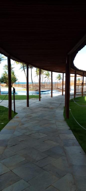 a large pavilion with a walkway in a park at Hotel pirâmide natal in Natal
