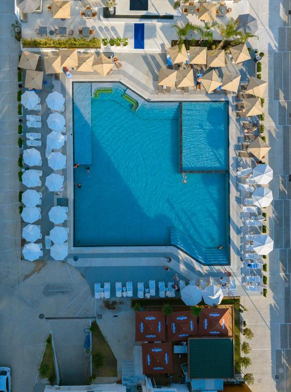 an overhead view of a pool at a resort at Maor Hotel in Vlorë