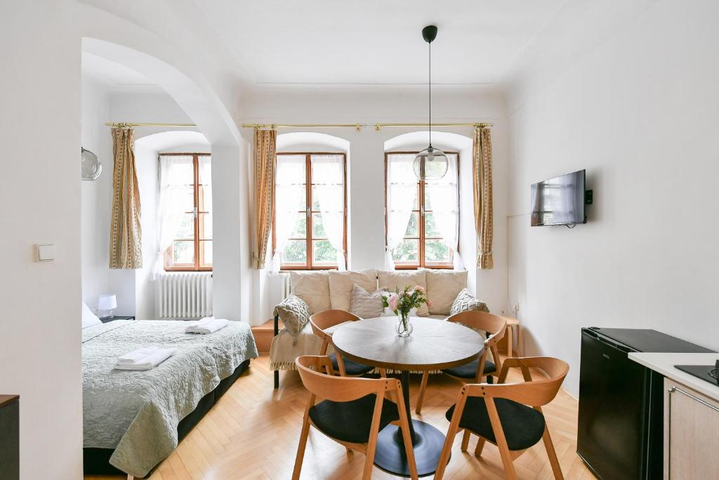 a living room with a table and a couch at TINY HOUSE Old Town in Prague