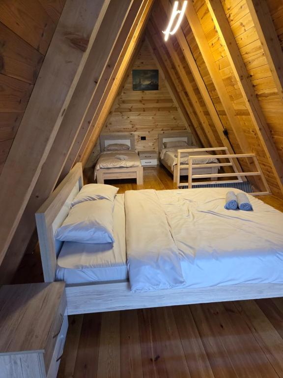 a room with three beds in a attic at LakeSideCottage in Plav