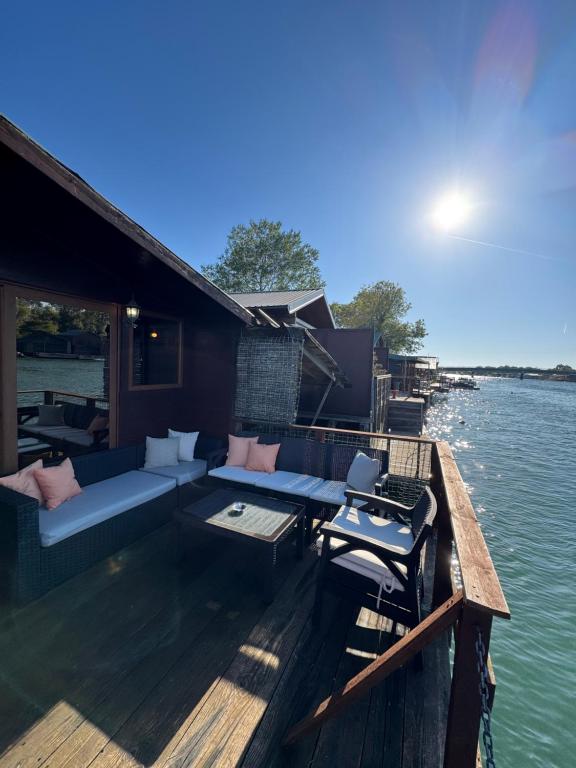 a house on a boat on the water at Florea Cottage in Ulcinj