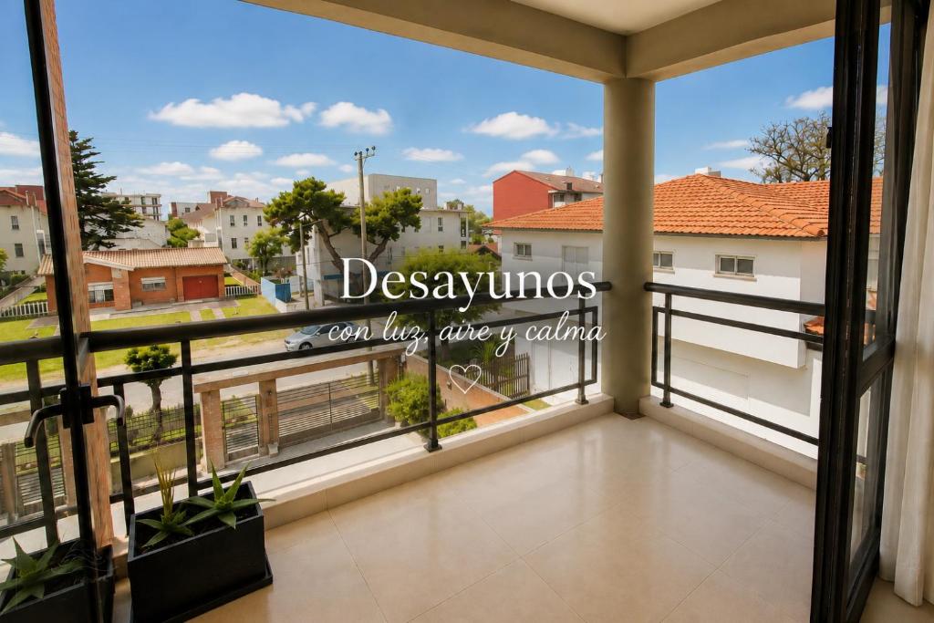 a balcony with a view of a city at Reflejo de Mar in Villa Gesell
