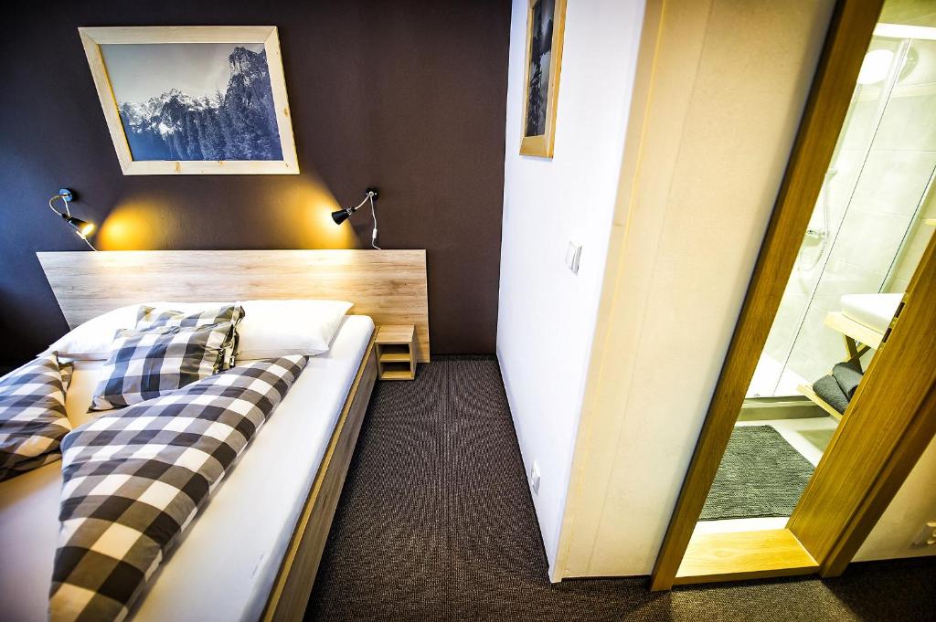 Letto o letti in una camera di Penzion Flores