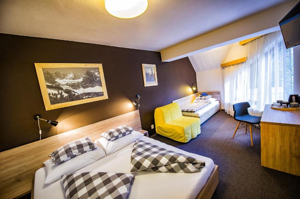 Letto o letti in una camera di Penzion Flores
