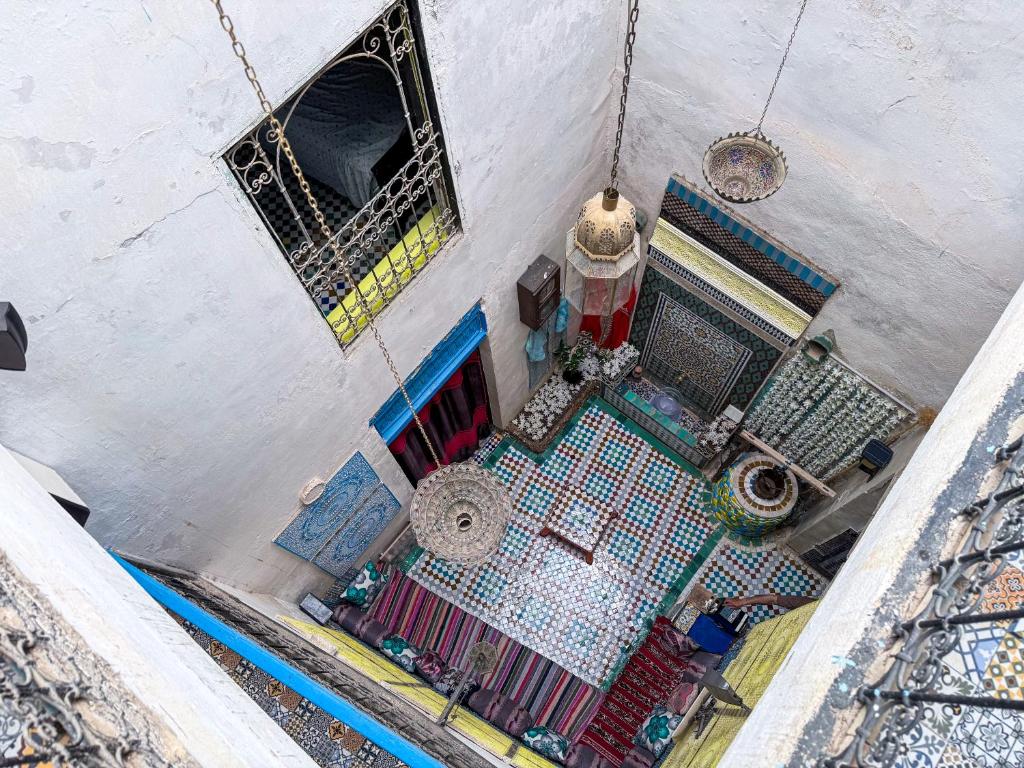 an overhead view of a building with a fence at Hostel Dar Caftan in Fez