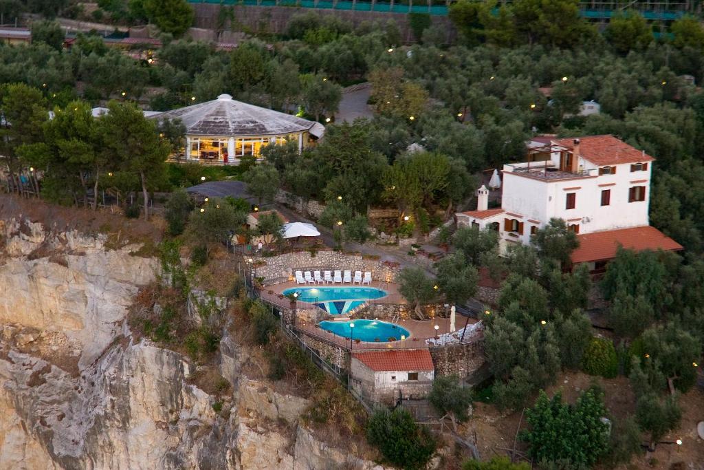 an aerial view of a resort with two swimming pools at Villaggio Villa Lubrense in Massa Lubrense