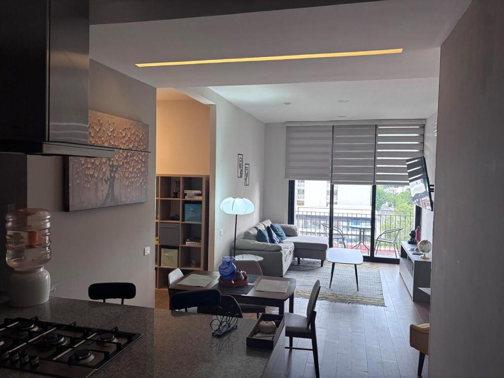 a living room with a couch and a table at Guadalajara American visa - 2 bedrooms in Milpillas