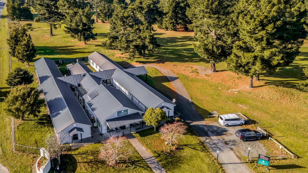 an overhead view of a large house with a car parked in front at Harewood Lodge in Christchurch