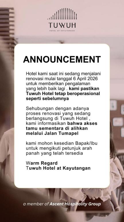 a sign that says empowerment with a picture of a woman at Tuwuh Hotel at Kayutangan in Malang