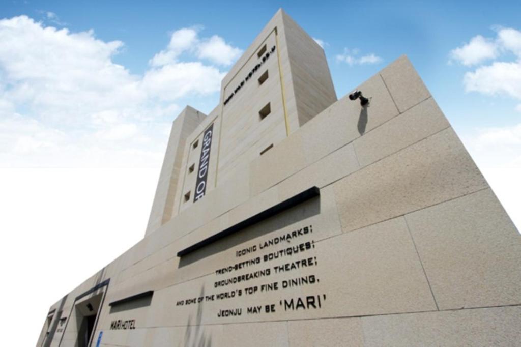 a building with writing on the side of it at Jeonju Mari Hotel in Jeonju