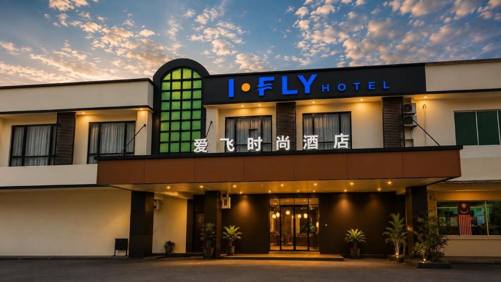 a hotel with a sign on the front of it at I Fly Hotel BSI in Tawau