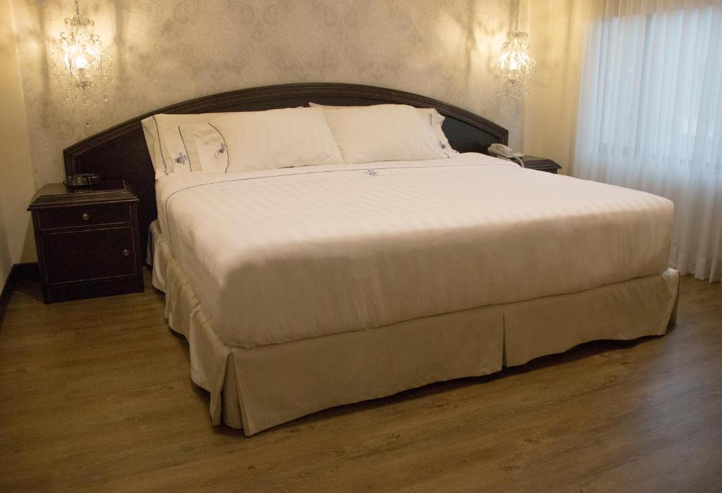 Postel nebo postele na pokoji v ubytování Hotel Castilla Real