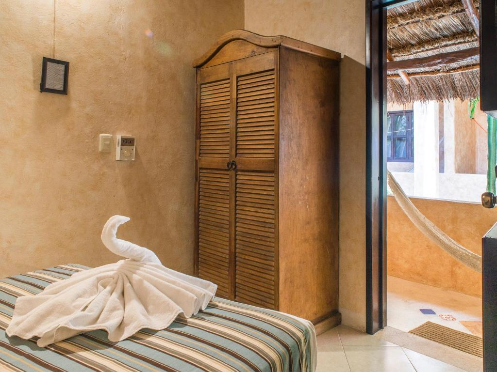 Postel nebo postele na pokoji v ubytování Hotel Barrio Latino