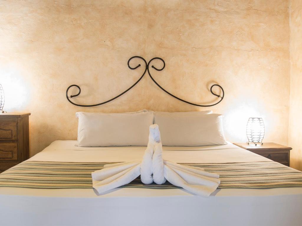 Postel nebo postele na pokoji v ubytování Hotel Barrio Latino