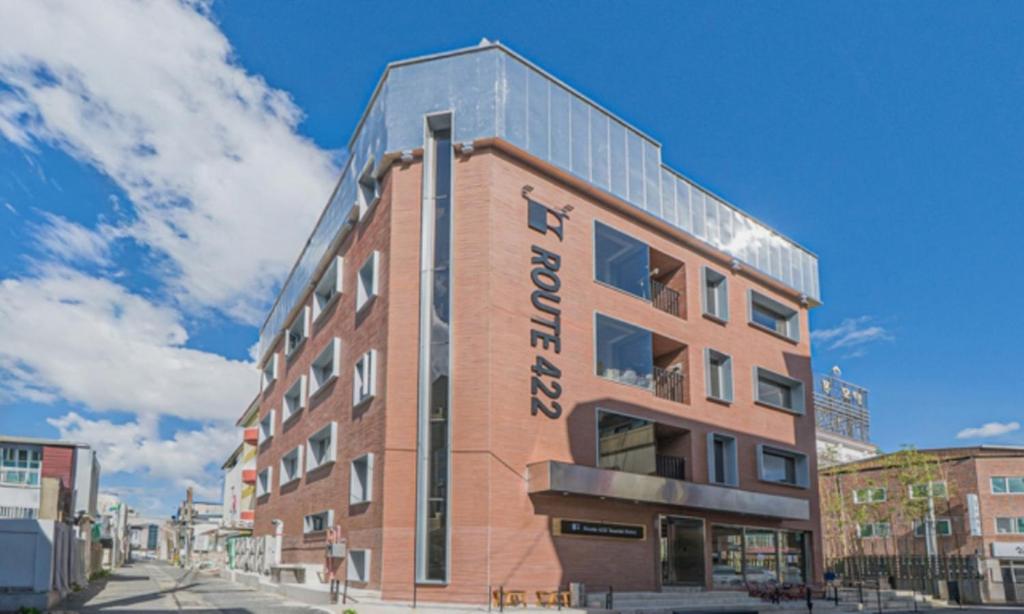 a red brick building with the words rewind on it at Pohang Daejamdong Route 422 in Pohang