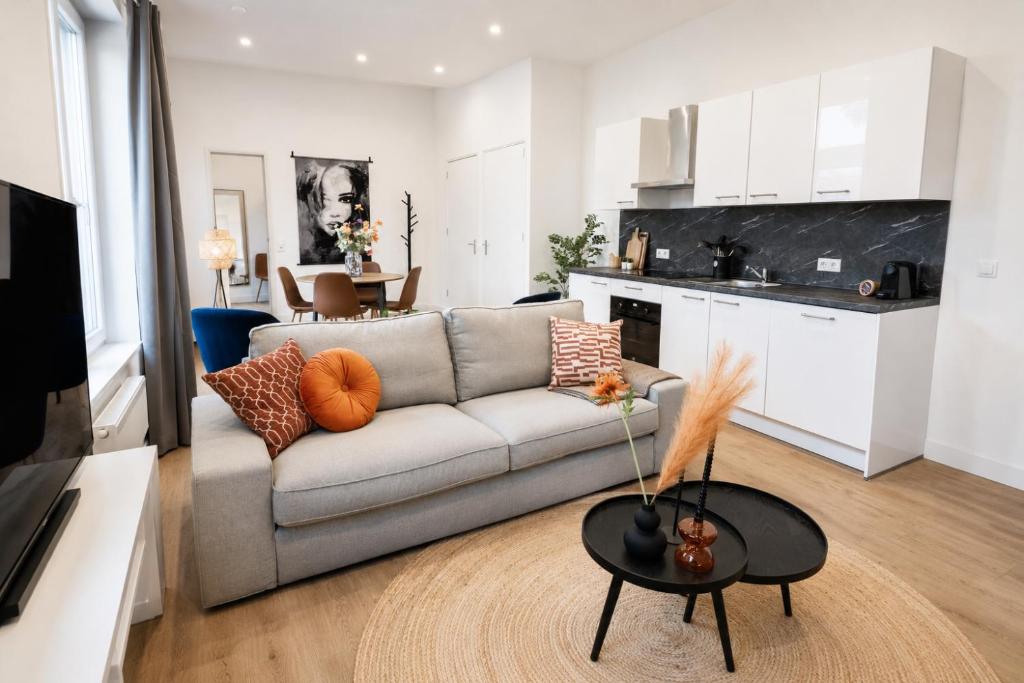 a living room with a couch and a table at Spacious Apartment in Tilburg Bed and Coffe in Tilburg