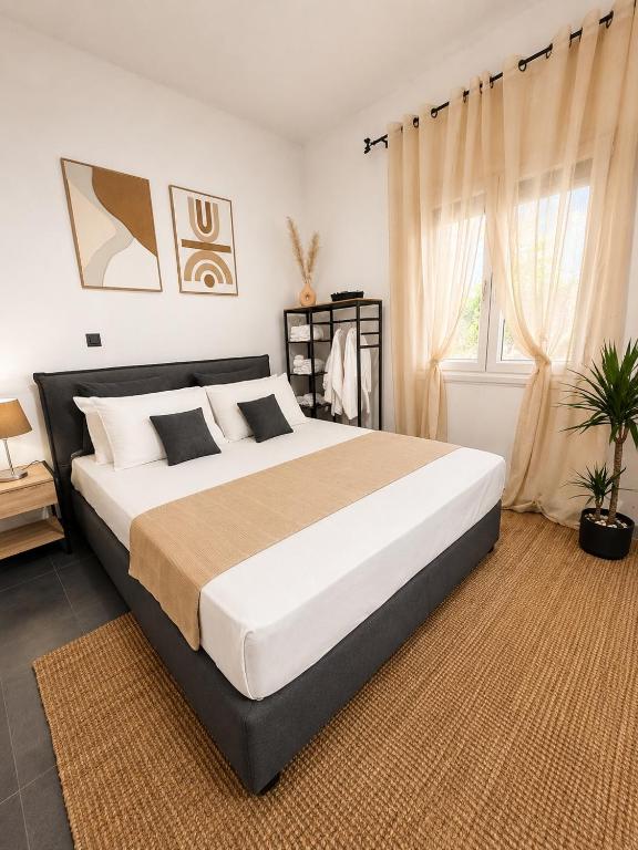a bedroom with a large bed in a room at AVG Studios Preveza in Mytikas