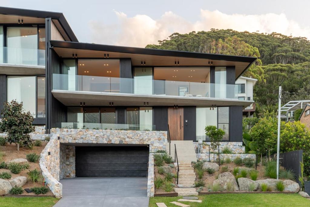 an image of a house with a garden at Casa Celeste, Grand Architectural Residence in Wollongong