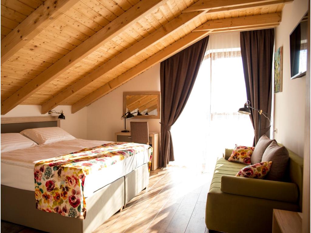 En eller flere senge i et værelse på Bed&Breakfast Vinarija Coner
