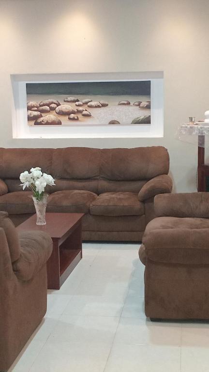 a living room with a couch and a table at The banglow homestay in Anuradhapura