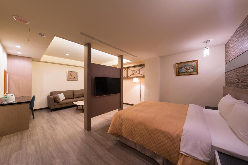 Postel nebo postele na pokoji v ubytování Sir Motel - Sanchong