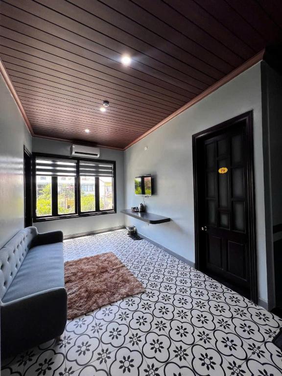 a living room with a couch and a window at Bông Phố Cổ Homestay in Ninh Binh