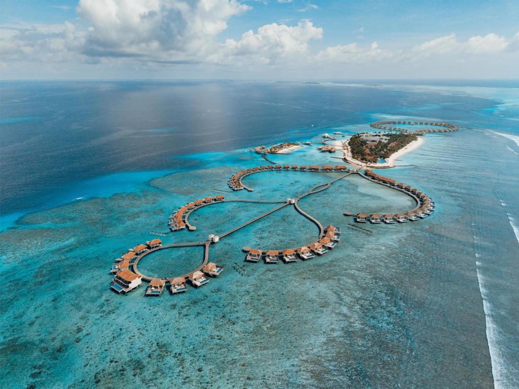 an aerial view of an island in the ocean at Radisson Blu Resort Maldives with 50 percent off on Sea Plane round trip 03 nights & above in Fenfushi