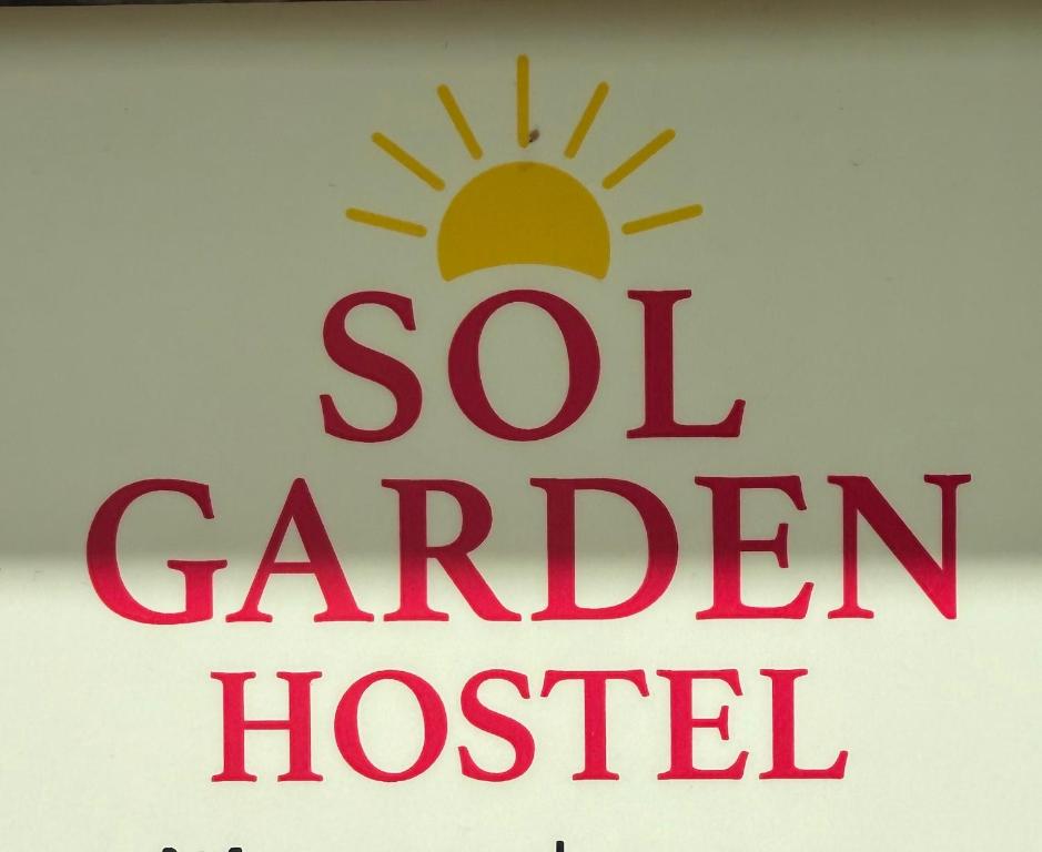 a sign for a soft garden hospital with the sun at Sol Garden - Hostel with a Soul in Pula