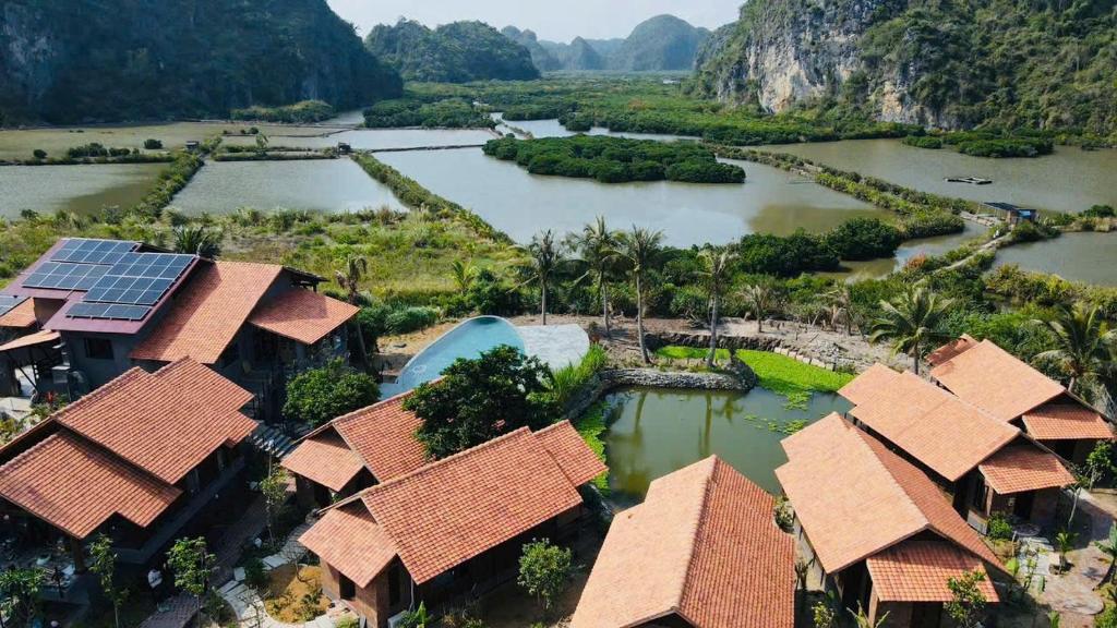 an aerial view of a resort with a river at Cabalina Grove in Ðảo Cát Bà
