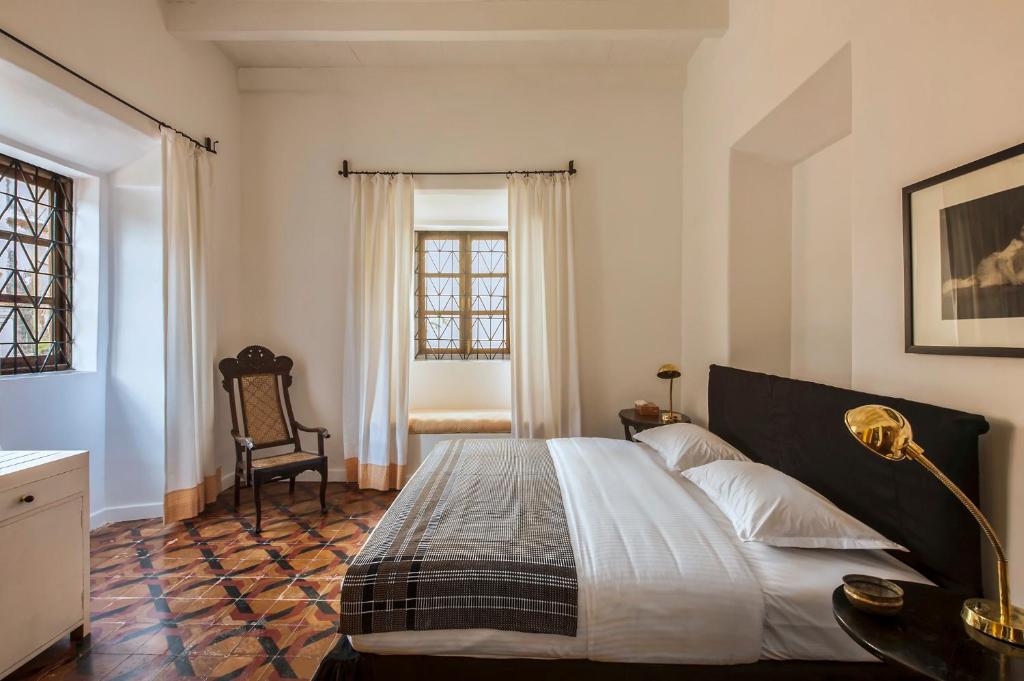 Postel nebo postele na pokoji v ubytování Mateus Boutique Hotel