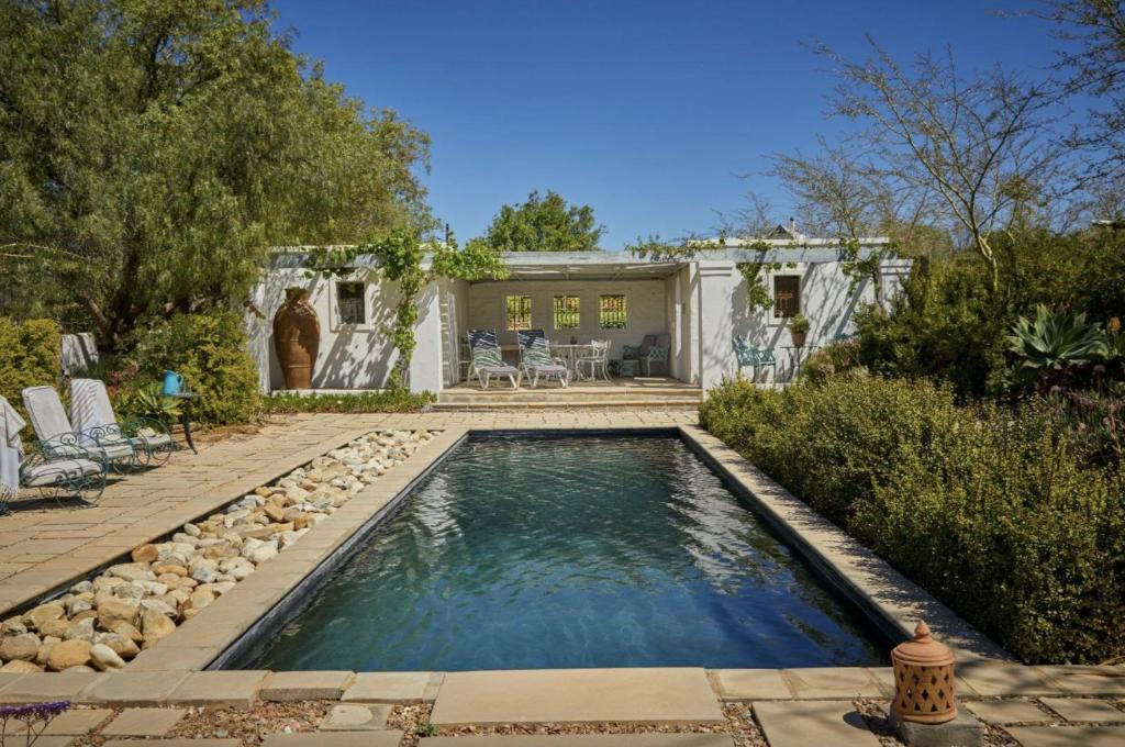 a swimming pool in the backyard of a house at Chalcedony in McGregor