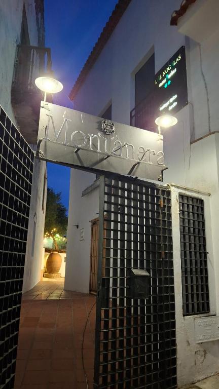 a entrance to a building with a sign on it at Ruralis Las Nogalas in Montánchez