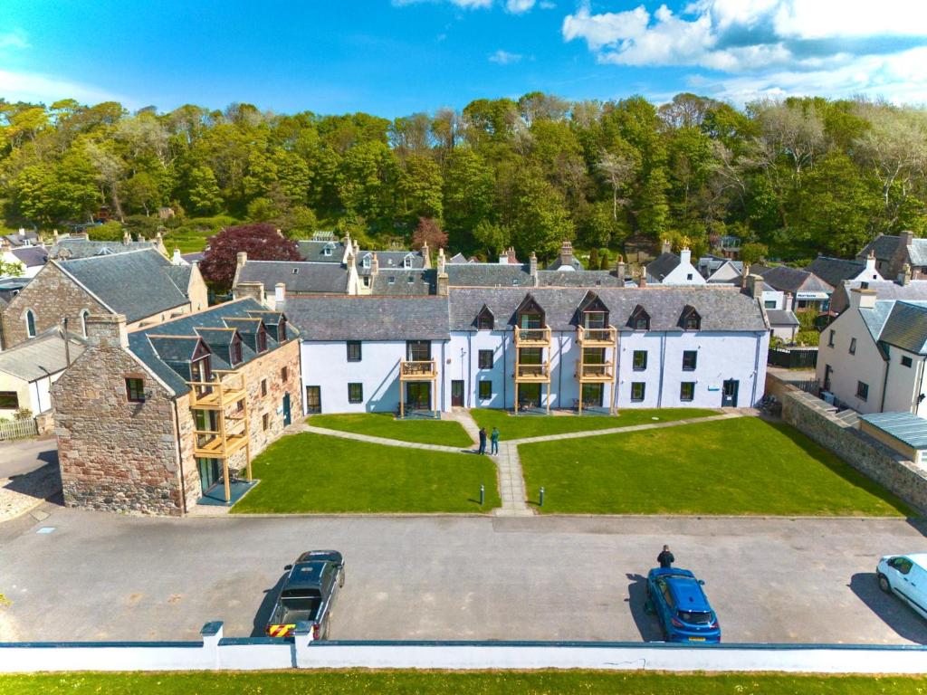 an aerial view of a large house with a yard at Dolphin Bay Suites in Ardersier