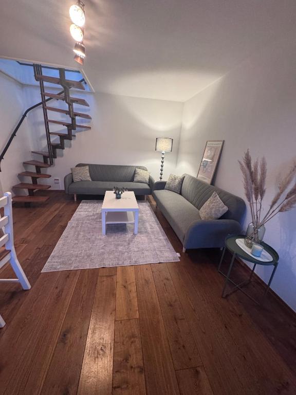a living room with a couch and a table at Ruheoase Quickborn in Quickborn