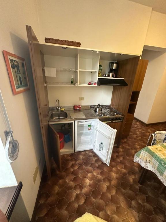 a small kitchen with a sink and a counter at Villa Elisabetta in Malcesine