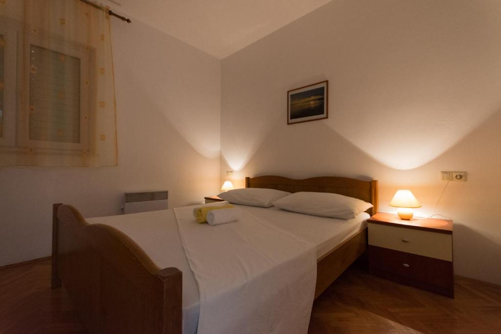 Postel nebo postele na pokoji v ubytování Apartmani Gaube