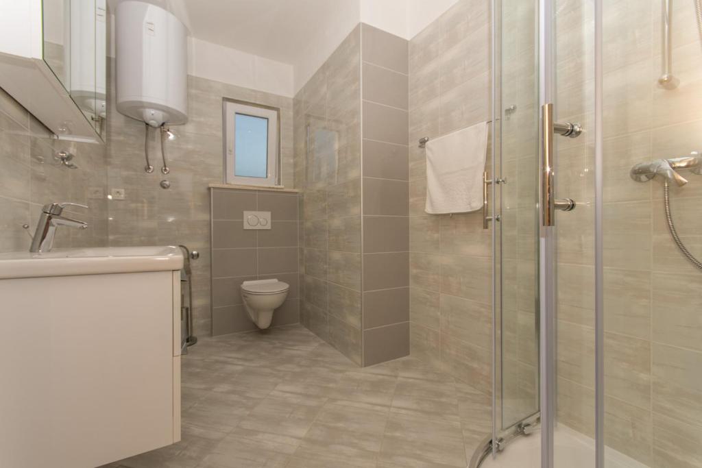 Koupelna v ubytování Apartmani Gaube