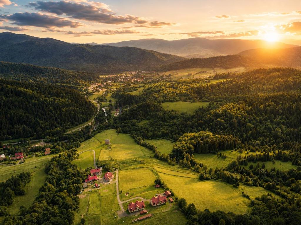 an aerial view of a village in the mountains at Apartamenty Pod Horodkiem in Cisna