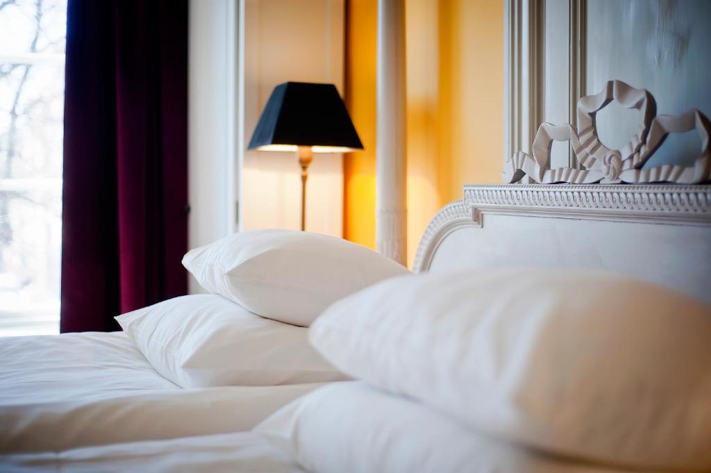 Postel nebo postele na pokoji v ubytování Hotel Hellstens Malmgård
