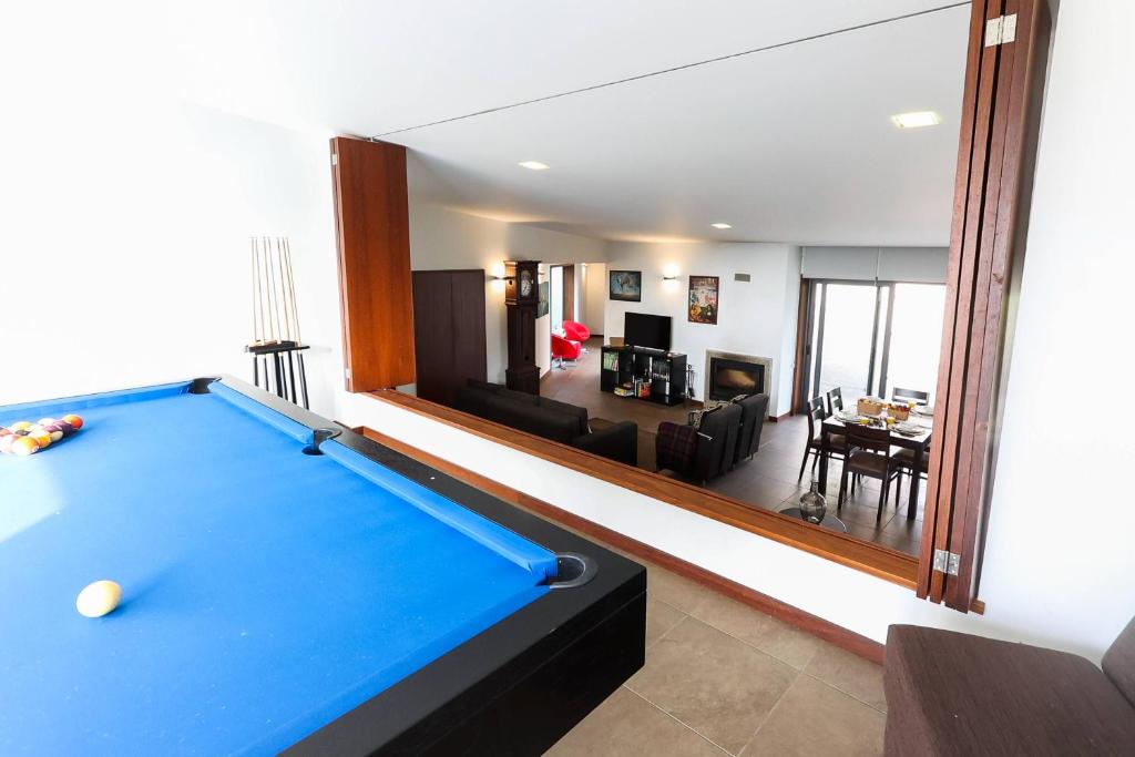 a room with a pool table and a living room at Casa de Freixo Casa de Freixo Refugio Tranquilo na Natureza in Ponte de Lima