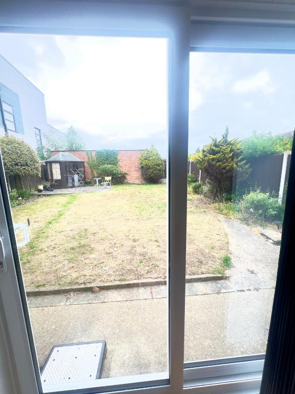 a view of a yard from a window at The Stanford Home in Horndon on the Hill