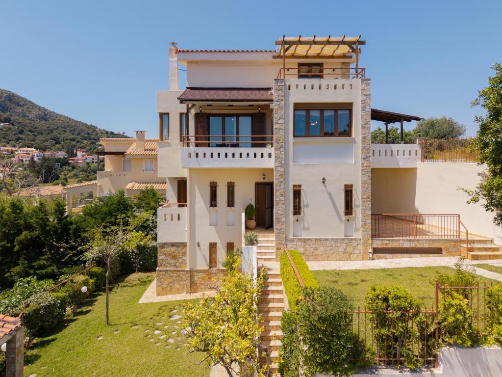 a villa with a view of a house at Theros Maisonette by A&D Properties in Porto Rafti