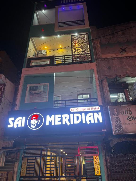 a sign on the side of a building at Sai Meridian in Pondicherry