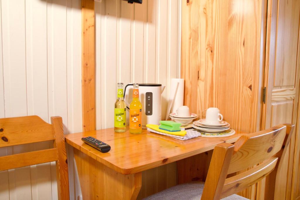 a wooden table with a coffee maker on it at Seetuun-Hoff - Studio in Nordstrand