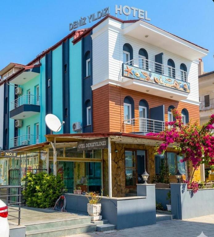 a hotel in the middle of a street at Otel DENİZYILDIZI CENTRUM in Fethiye